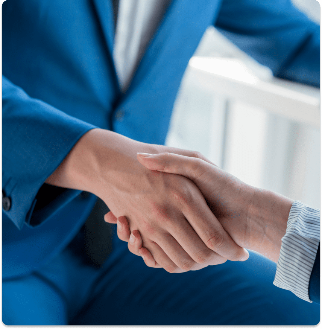 two-business-partners-shaking-hands-office (1) (1) two business partners shaking hands office 1 1